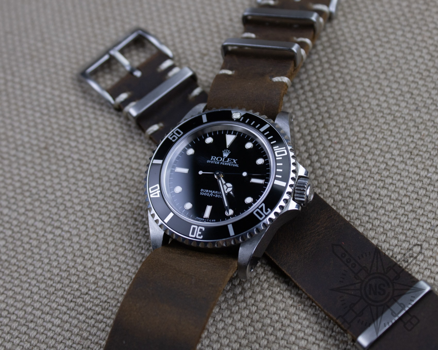 Artisans at work crafting leather watch bands with precision.