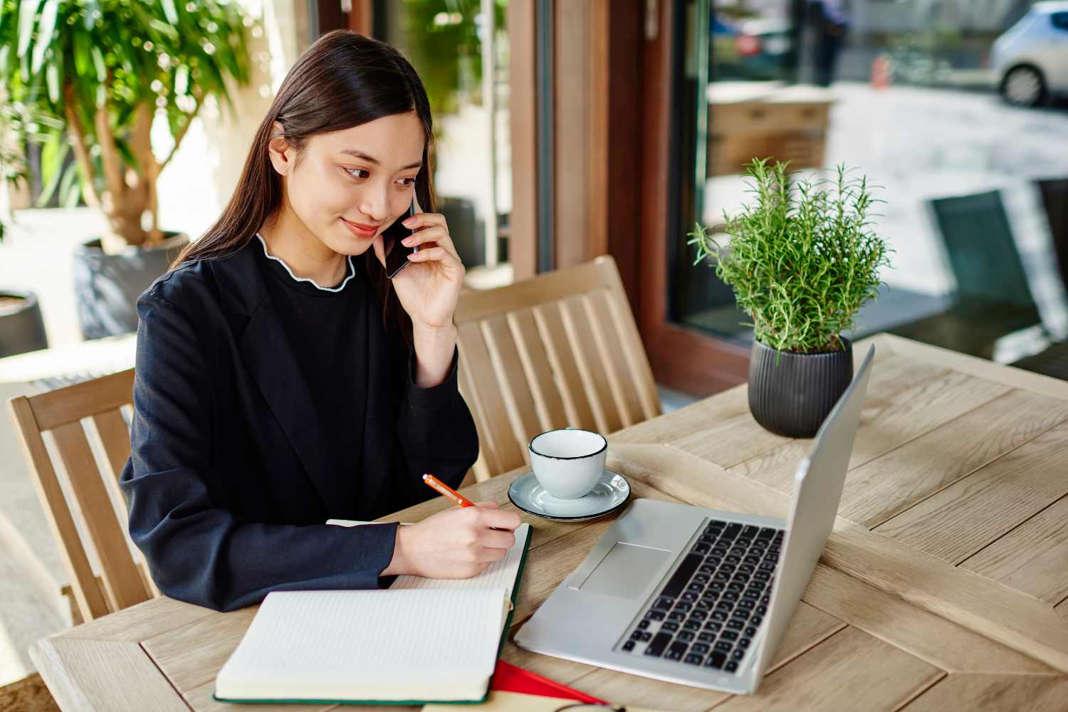 Remote employee smiling while answering phone call.