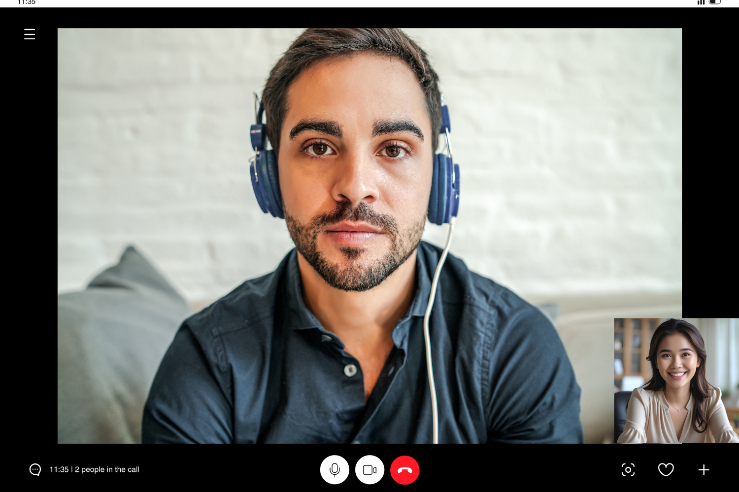 A Western manager and a Filipino employee on video call.