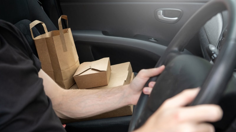 Kraft paper takeaway boxes in a car seat