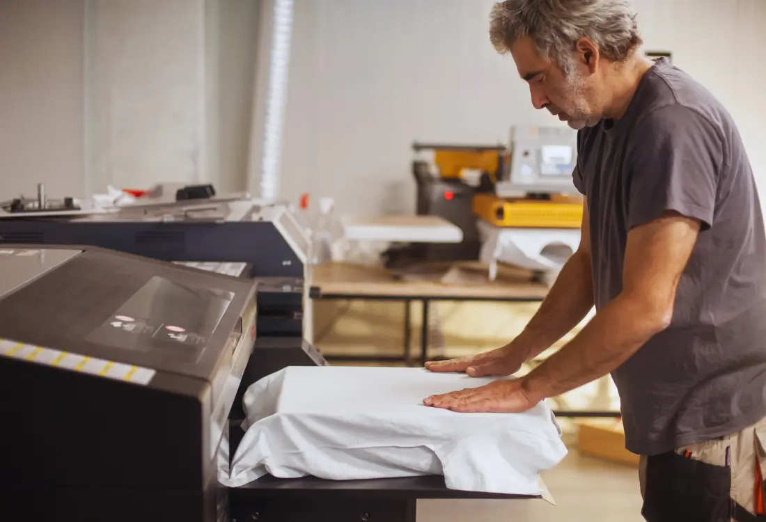 Close-up of high quality printed clothing using garment printers for complex artwork, highlighting DTG printing cost benefits and eco friendly water based inks.
