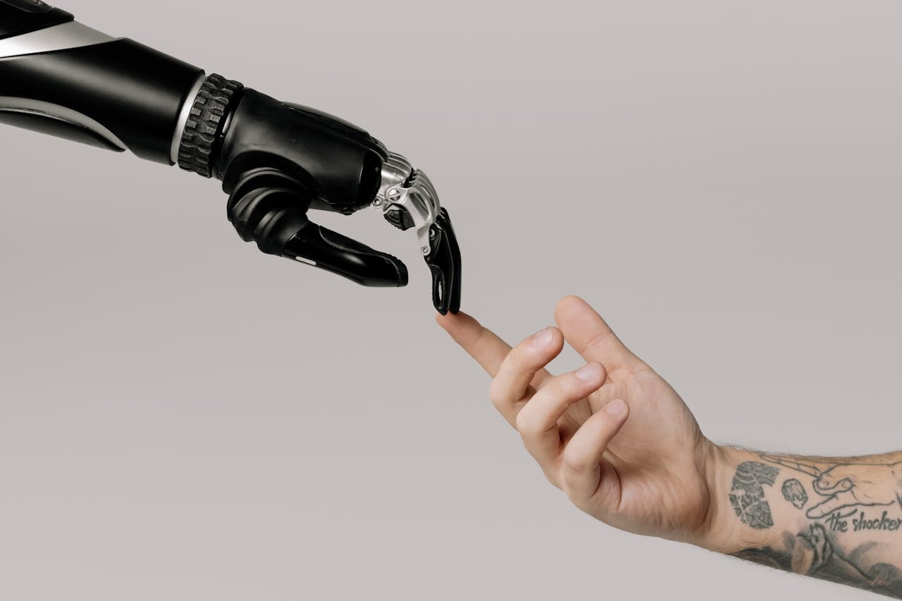 Robotic hand and human hand mimicking "The Creatin of Adam"