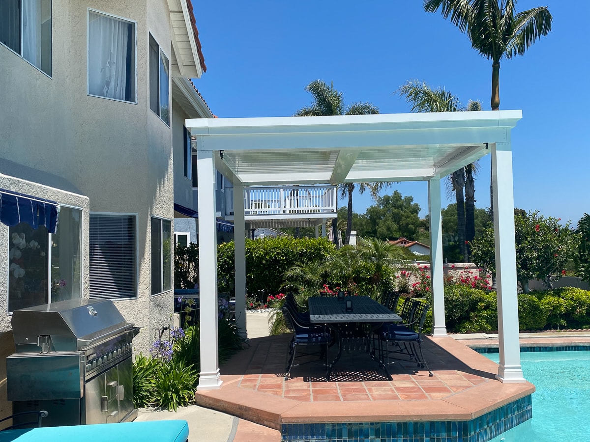 Custom Pools next to a pergola are an ideal addition to your backyard.