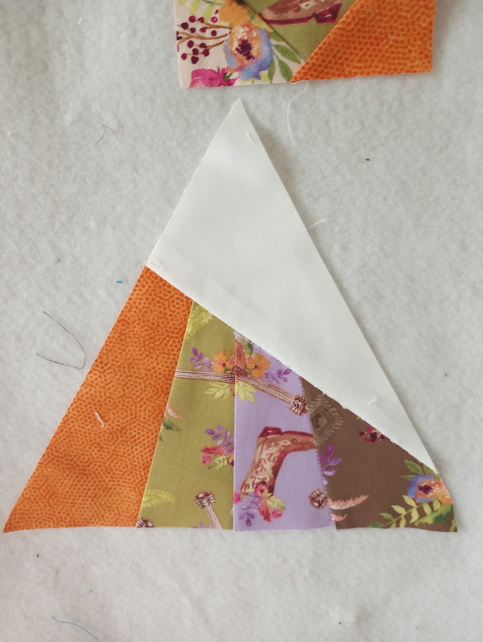 Image shows Linda's Scrappy Whirligig one of our free quilt patterns