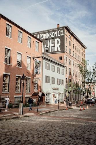 A sunny day on cobblestone streets in downtown Portland