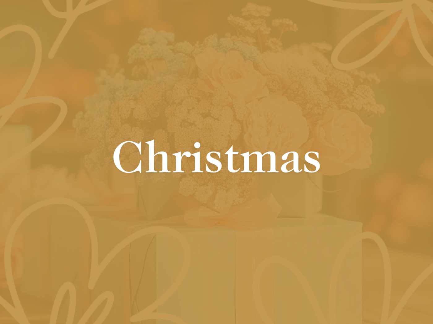 A tastefully blurred bouquet of cream flowers with the word 'Christmas' highlighted, part of the festive collection at Fabulous Flowers and Gifts.