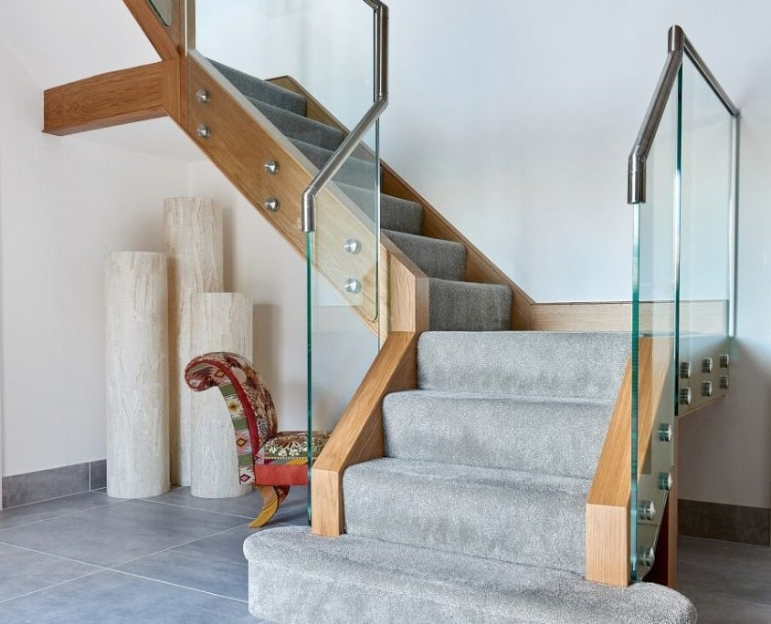 modern staircase, combining sleek glass with oak
