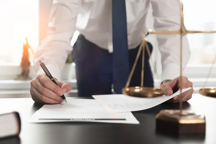 Lawyer signing a document