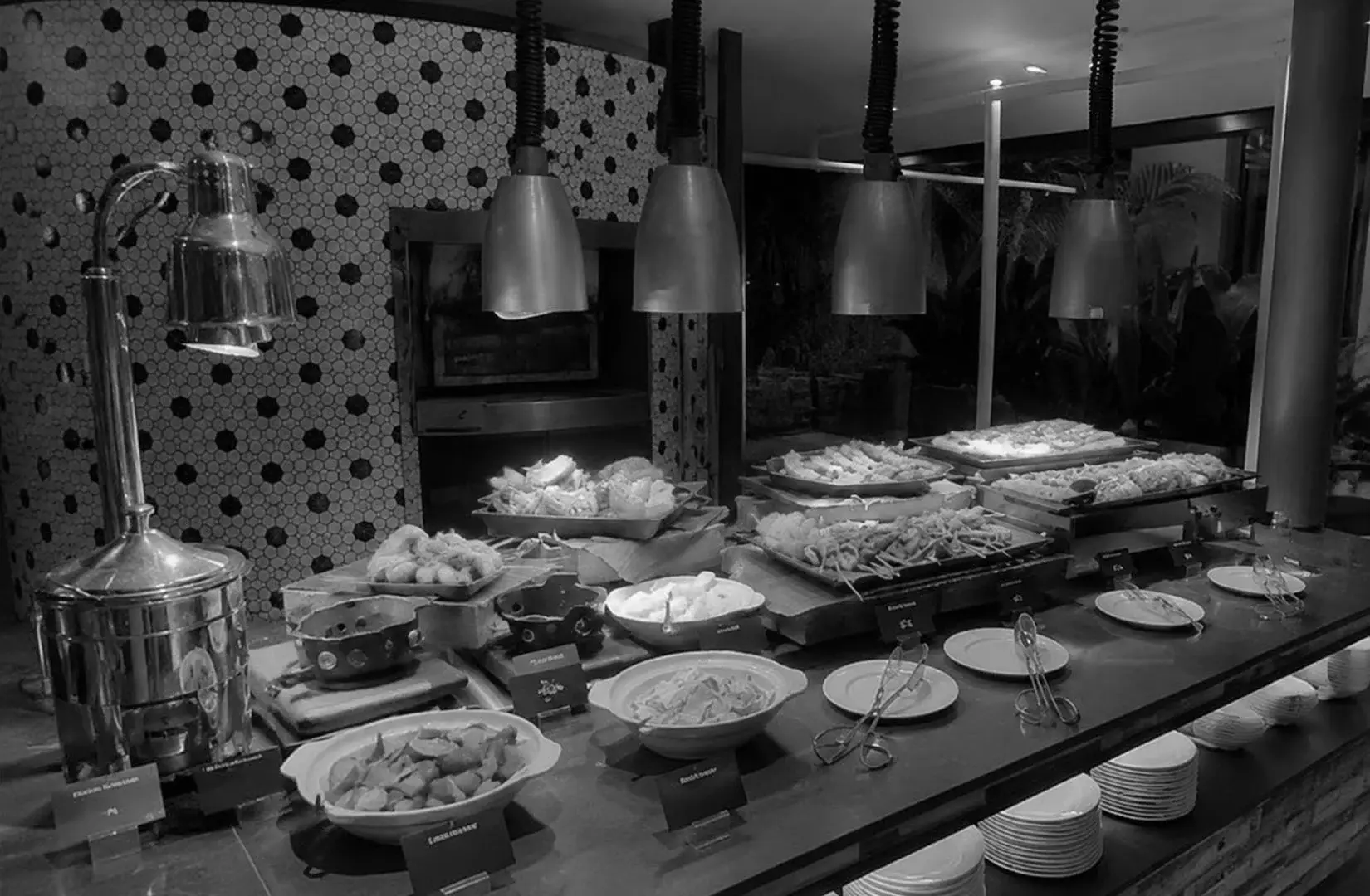 Embu Singapore buffet counter with neatly arranged food selections and serving stations.
