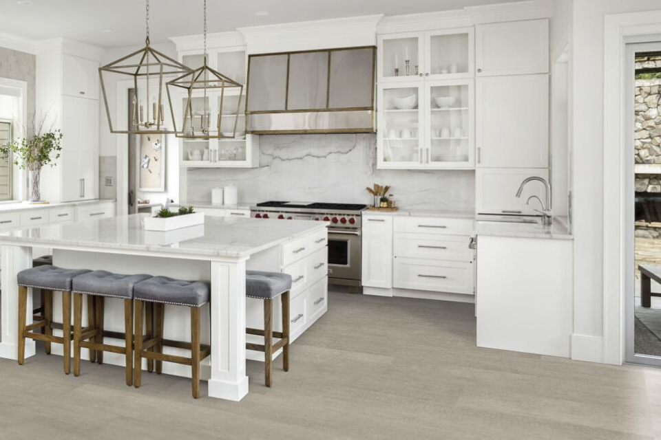 grey wood-look luxury vinyl in modern white kitchen