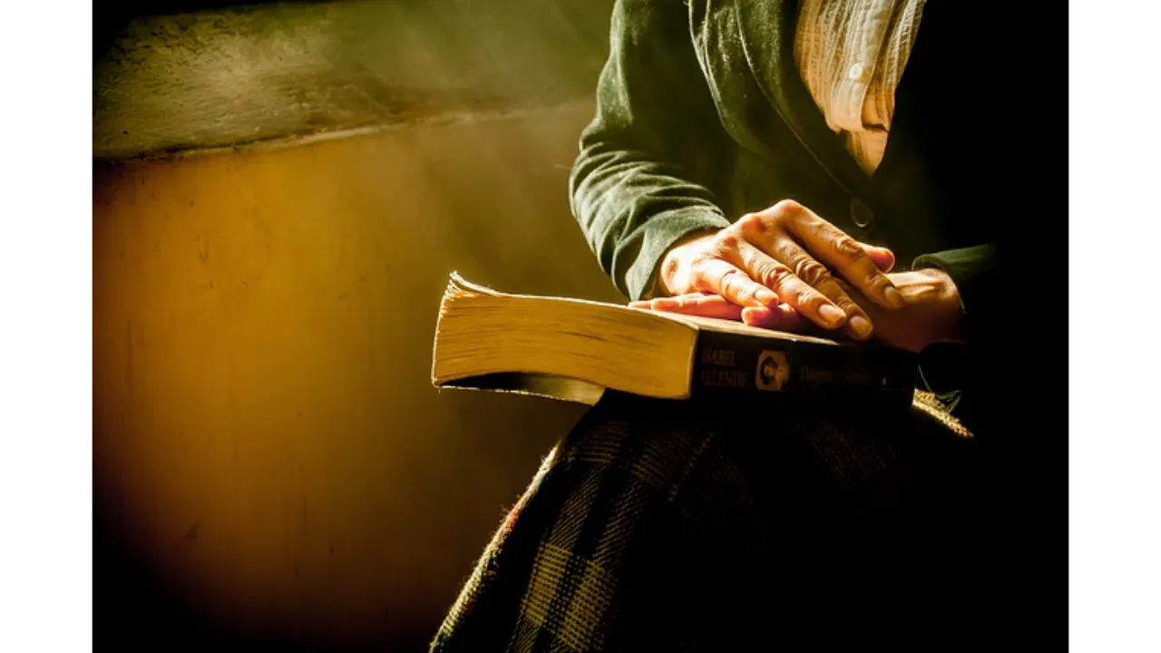 book,woman,hands,- A Family member nneds perfect confidence in their pastoral care, a never failing care. Like a new devotional they may hold tightly for mercy in their brush with death or other suffering.