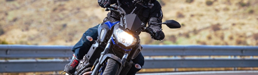 Motorcyle on a curve demonstrates the instability of motorcycles compared to cars.