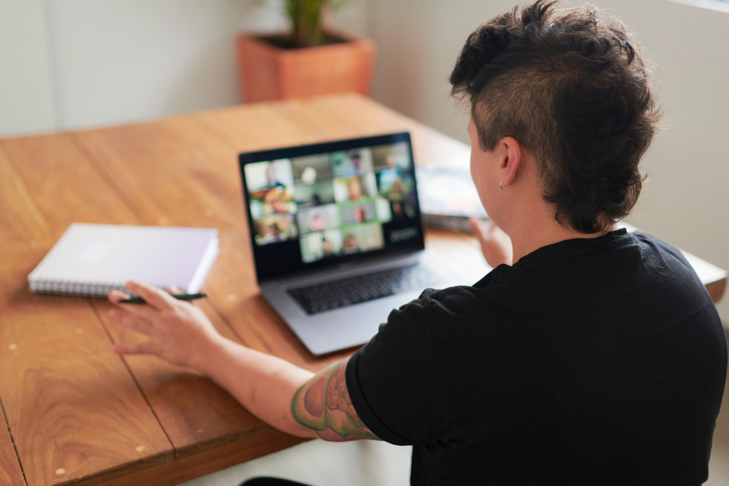 Person on a video call with teammates.