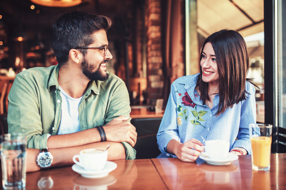 A couple enjoying a first date while engaging in conversation.