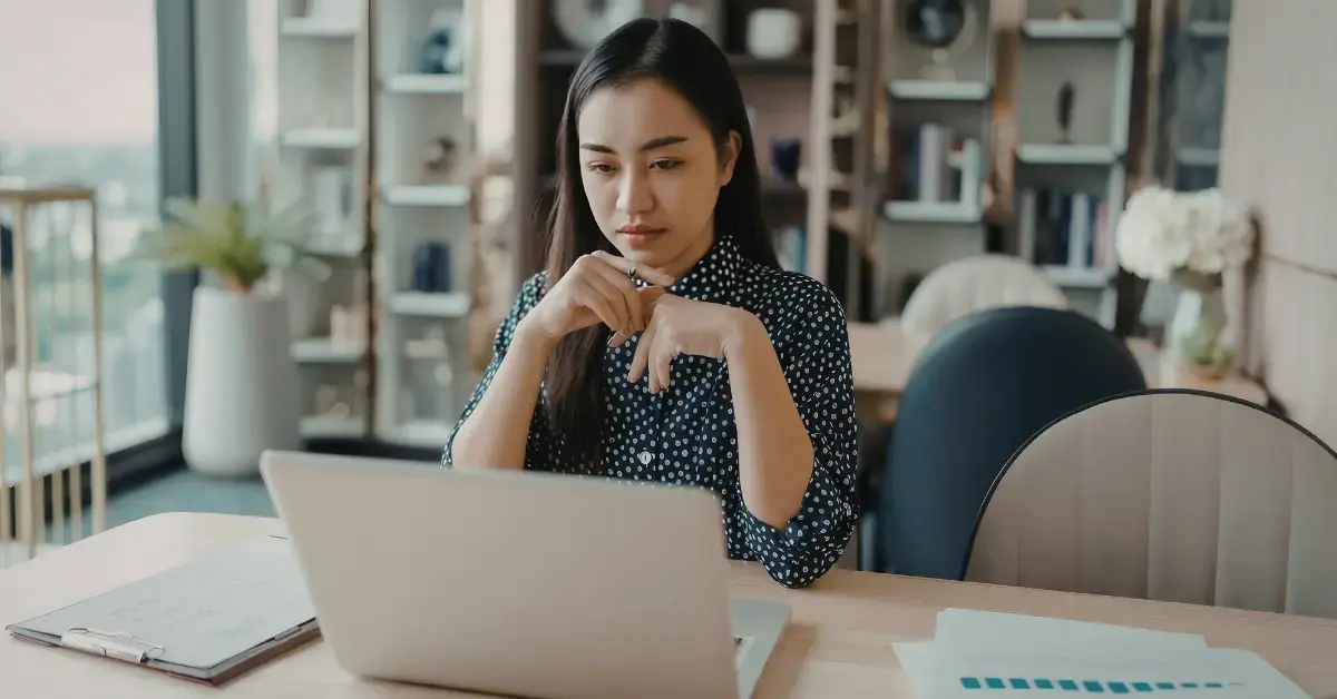 Woman reviewing an IRS bank levy notice and frozen bank account.