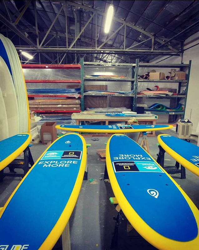 glide paddle boards in warehouse