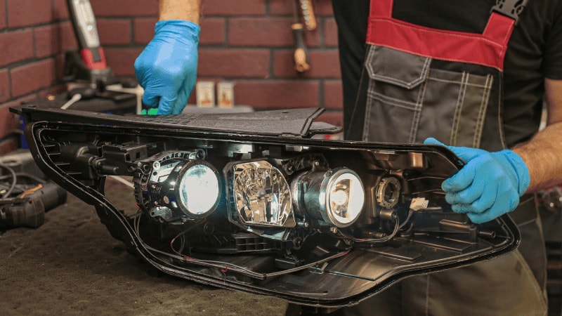 A worker fixing an entire LED assembly