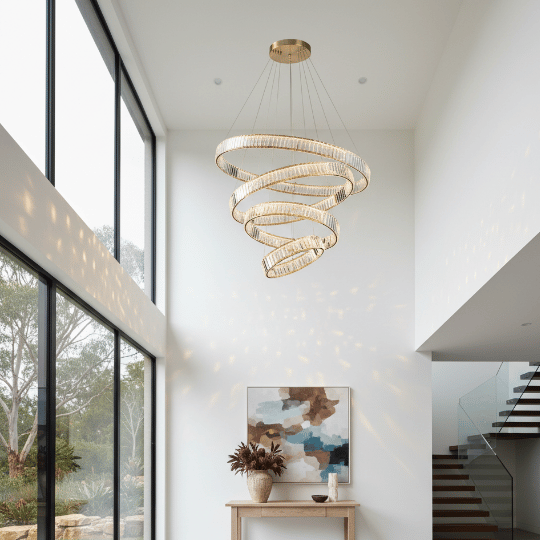 Spiral crystal chandelier suspended in a double-height living space, showcasing contemporary lighting ideas with a sculptural modern design.