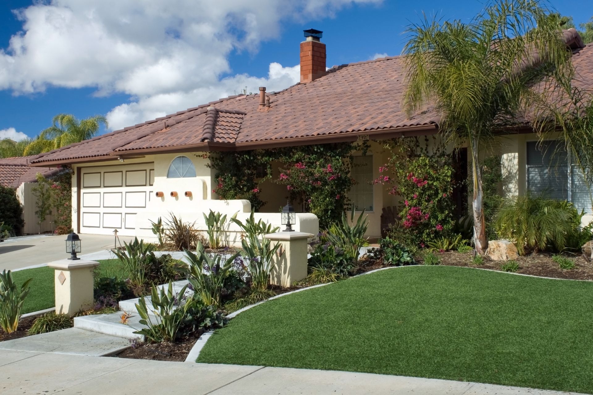 side-by-side comparison of synthetic and natural lawns. synthetic lawn appears lush and green, while natural lawn looks dry and patchy. icons representing watering, mowing, fertilizing, and weeding are crossed out over the synthetic lawn.
