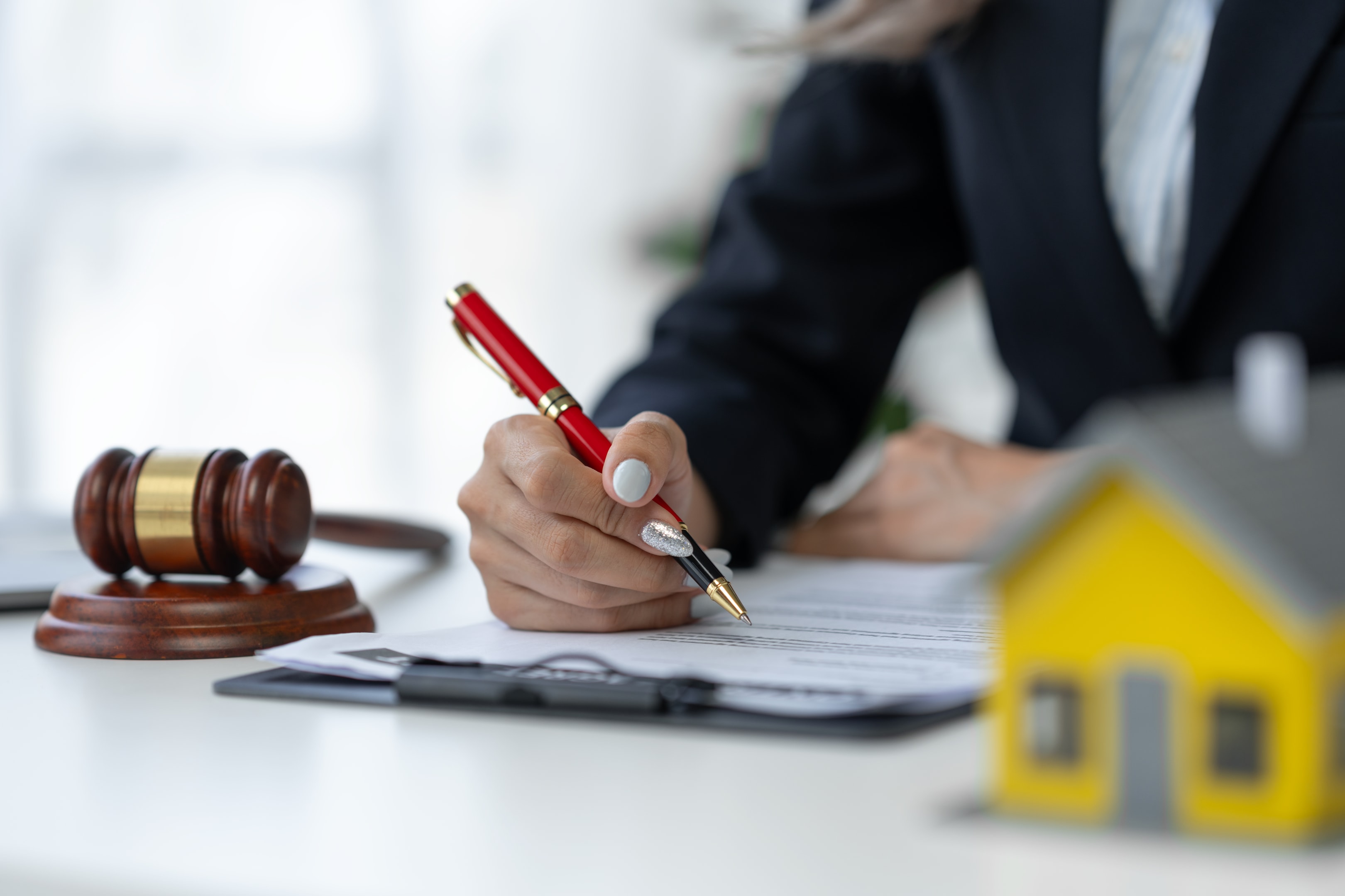 Attractive and confident female lawyer holding pen working in office with reading contract doc, divorce, married couple, divorce order, married overseas, divorce, spouse