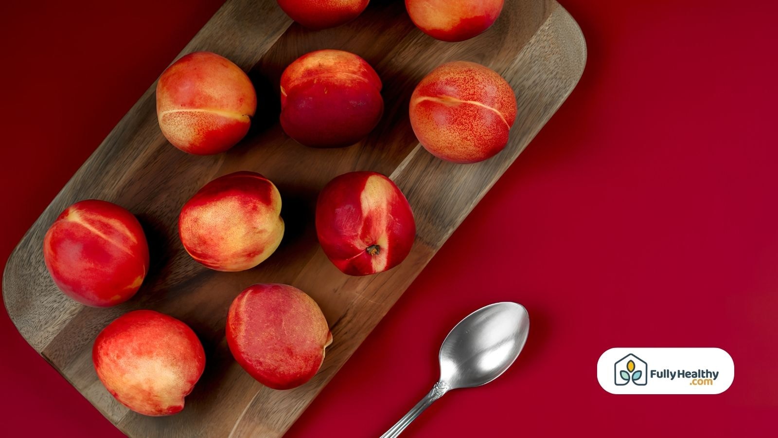 Fresh nectarines arranged on a wooden board