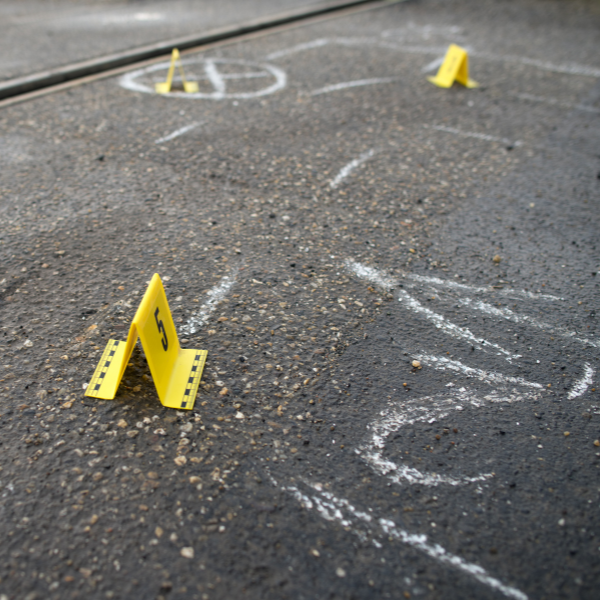 An image of investigators assessing the accident scene to determine liability.