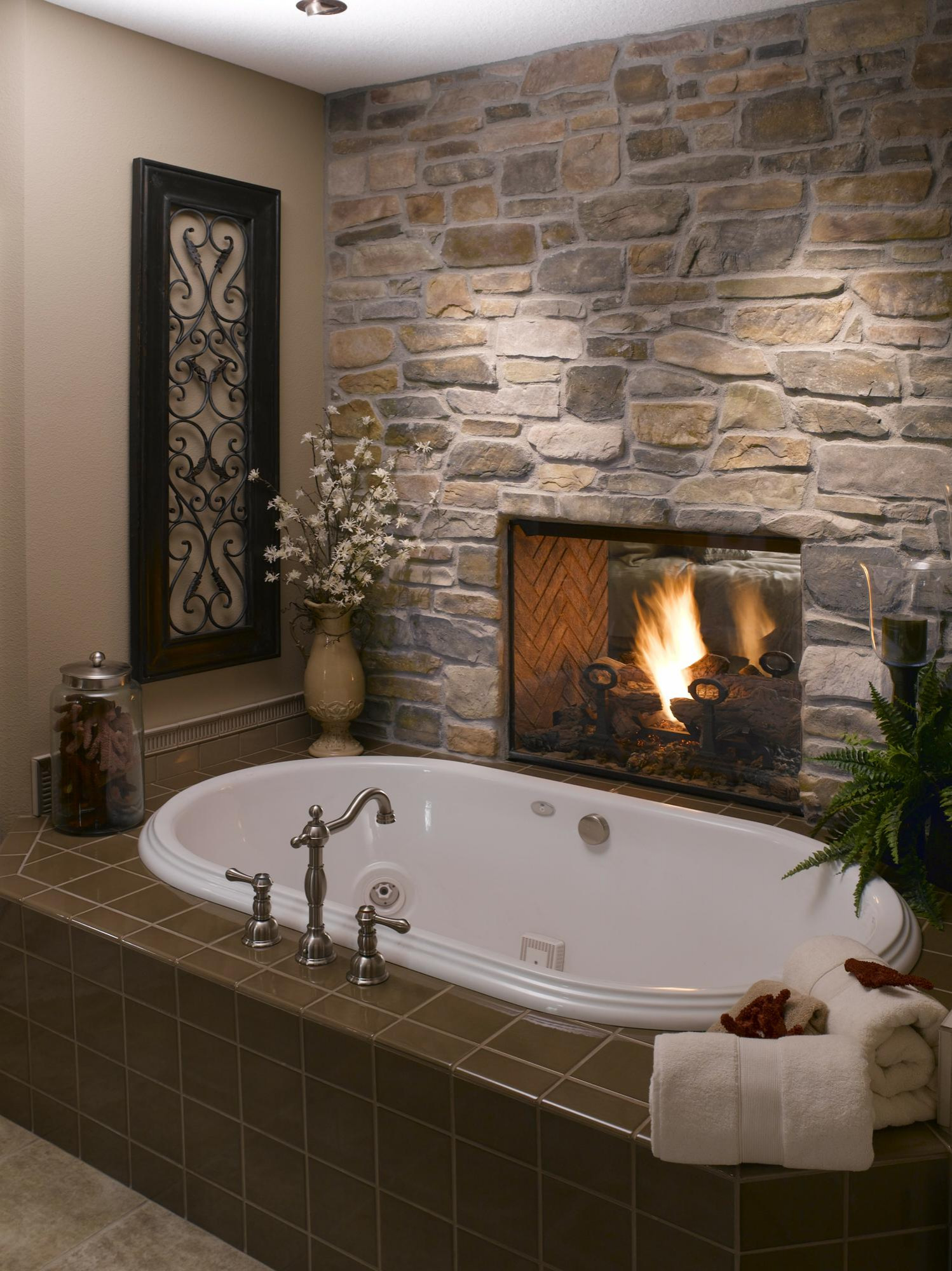  Rustic bathroom with stone fireplace