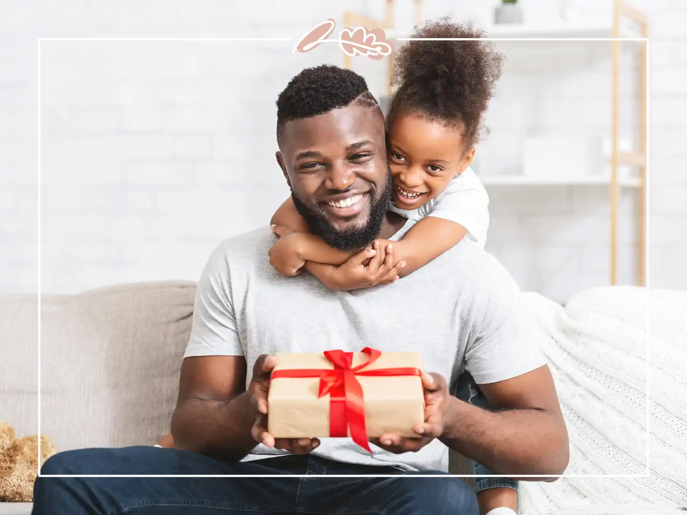 Man holding a young girl who is giving him a gift - fabulous flowers and gifts