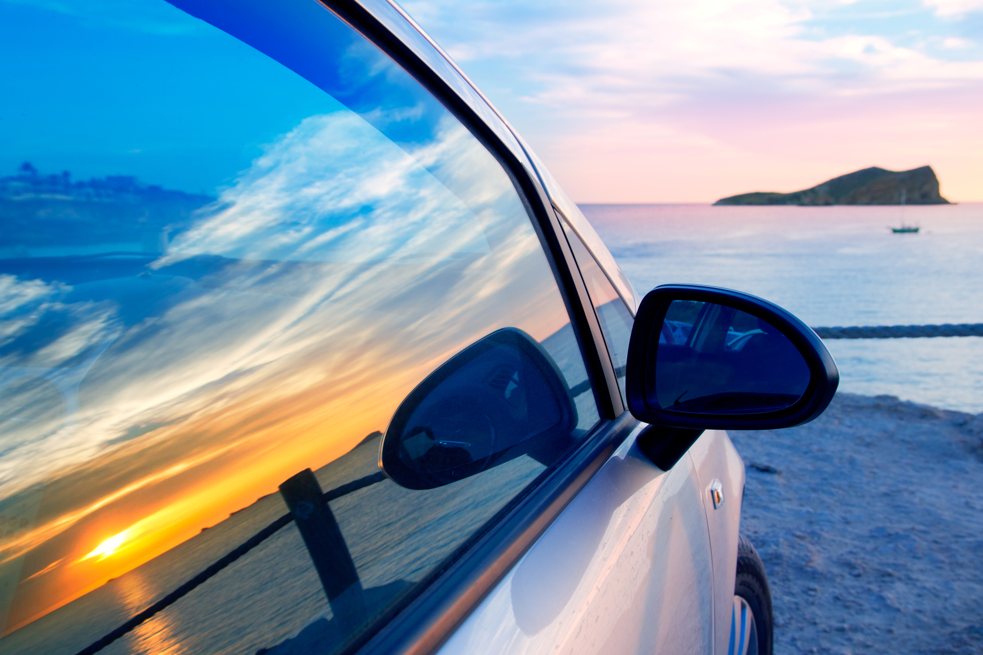 Sun and beach reflection on auto glass