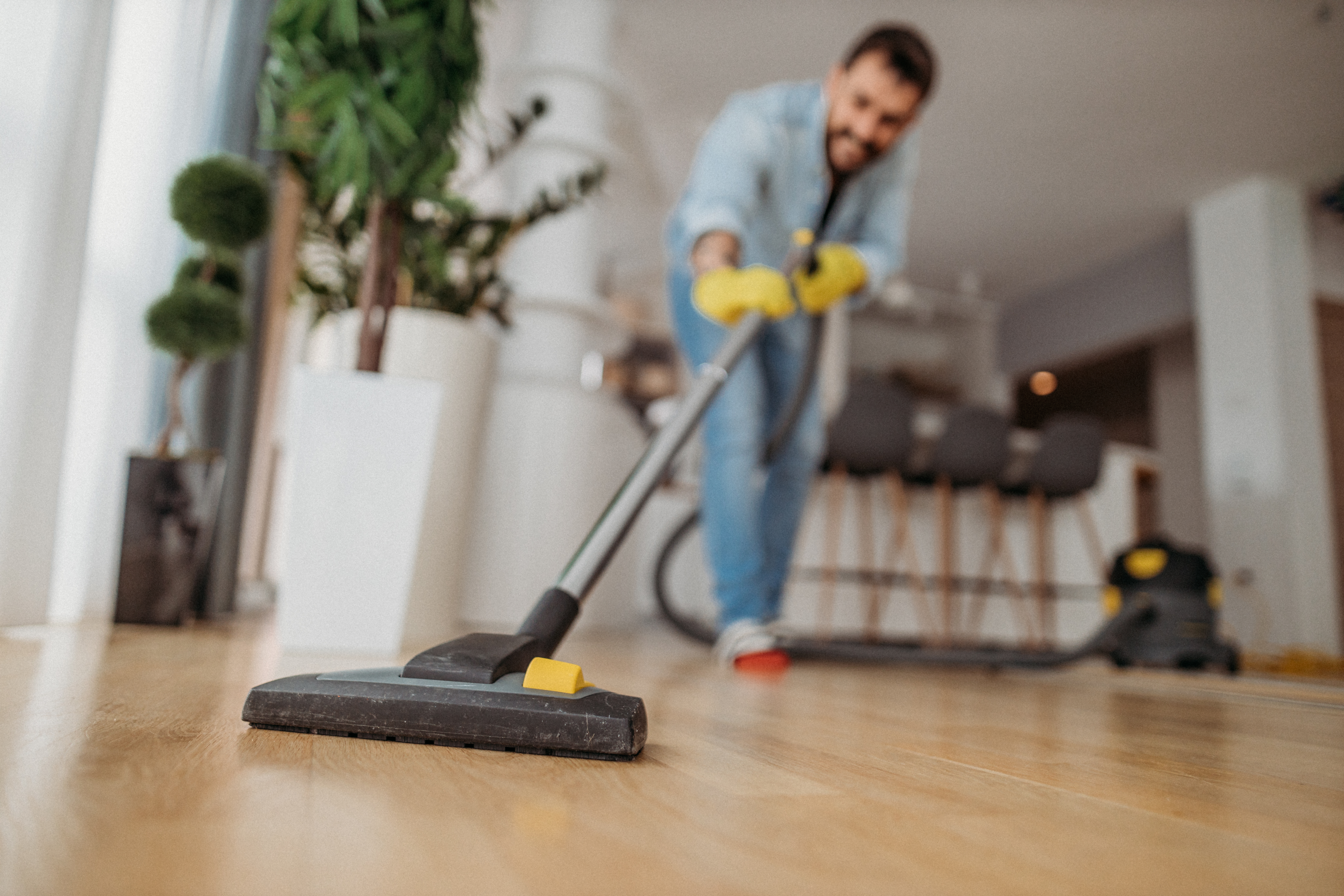 Cleaner vacuuming hardwood floors