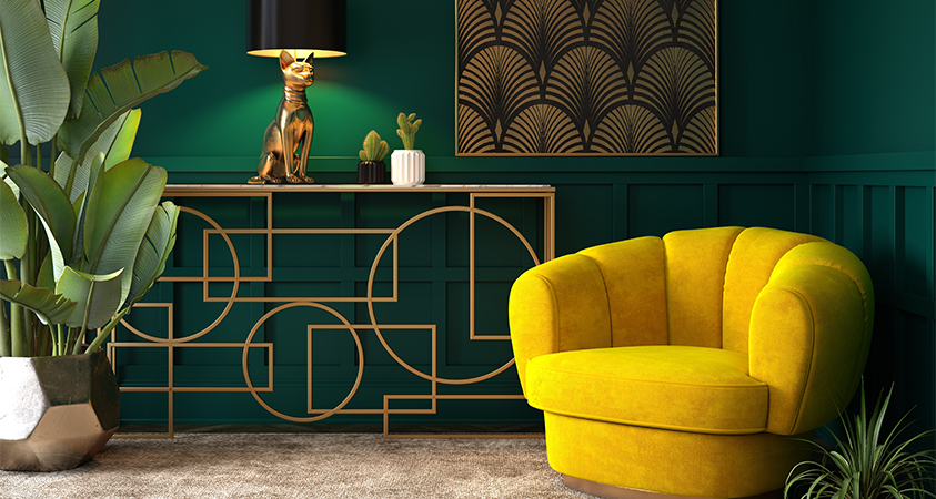 Art Deco is an interior design style that favours bold colours, geometric shapes and clean lines, such as this yellow and green living room with an eclectic metallic side table and fan motif artwork.