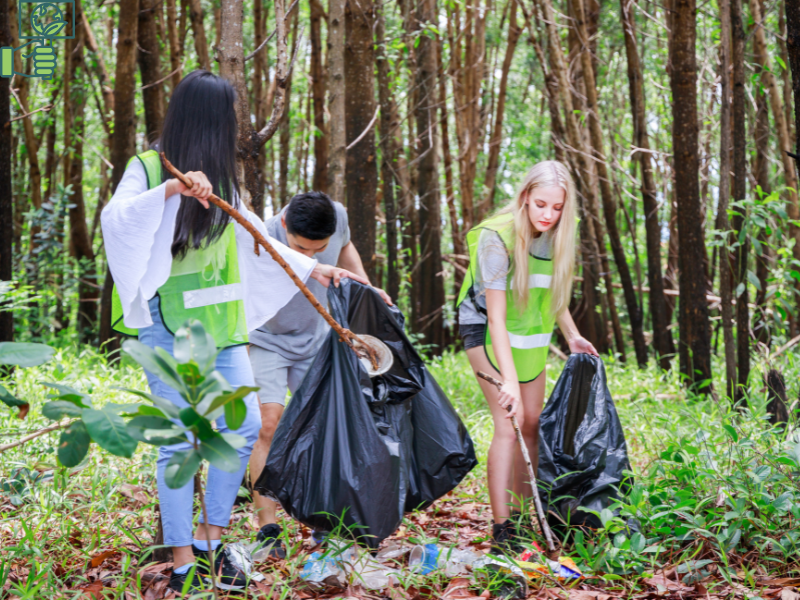 Environmental Activist youngsters cleaning the forest.