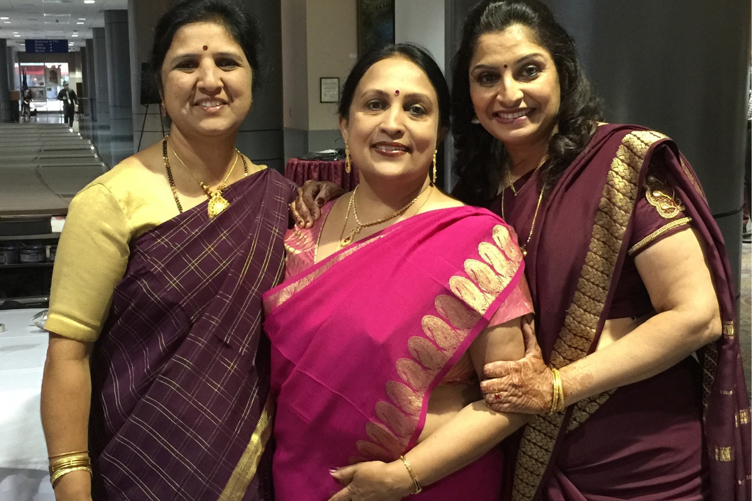 three women dressed in mysore silk saree