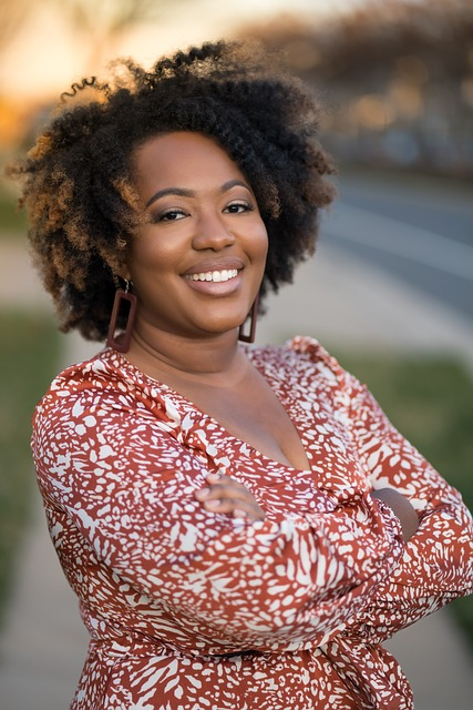 How Minority Temporary Staffing Solutions Can Optimize Your Business Operations 12 black woman smiling with arms folded