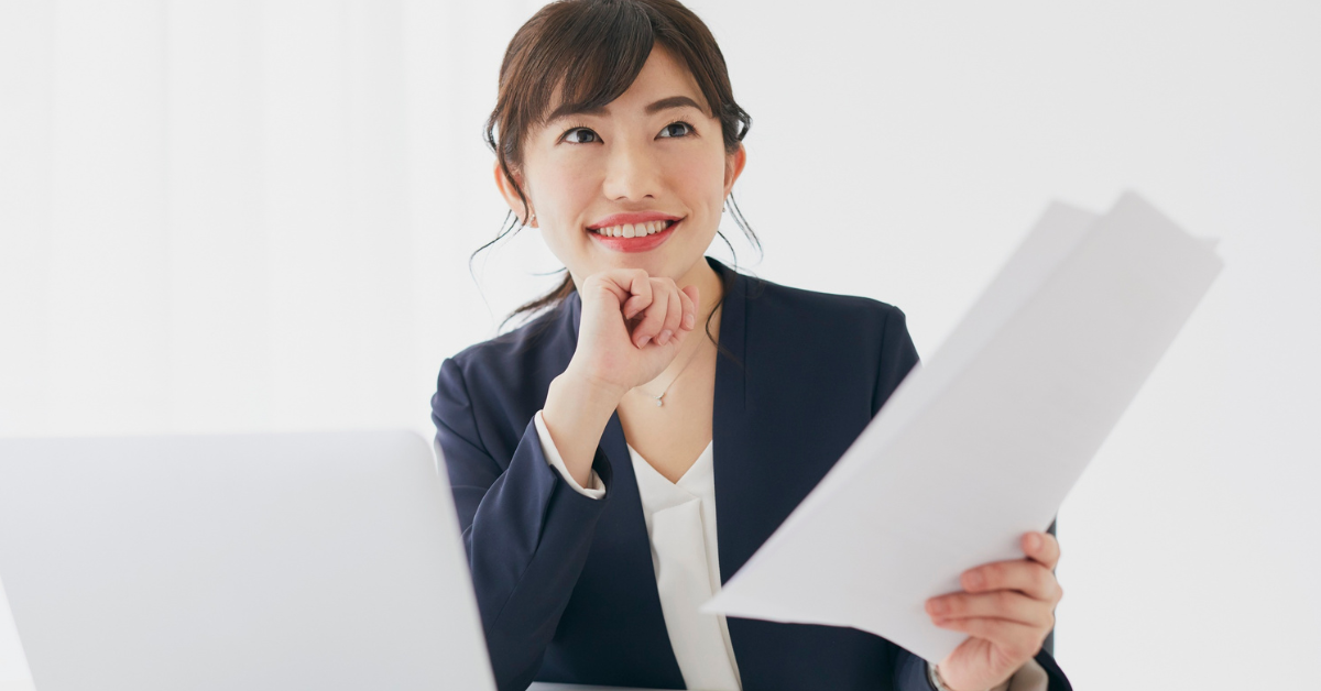 OnlyFans creator smiling after successfully understanding what is a tax voucher and completing her tax filing process.