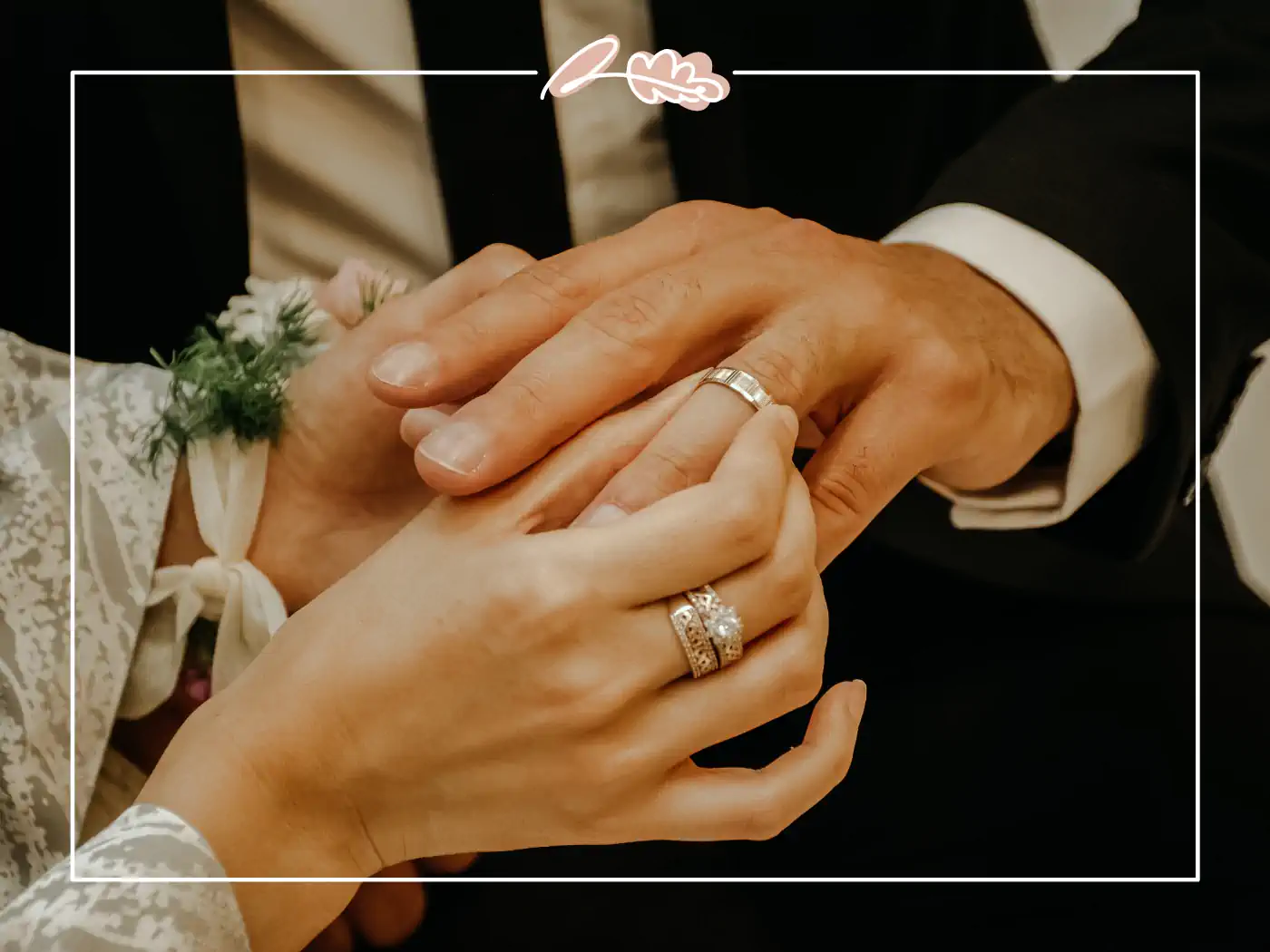 Close-up of a bride and groom holding hands, showcasing their wedding rings. Fabulous Flowers & Gifts