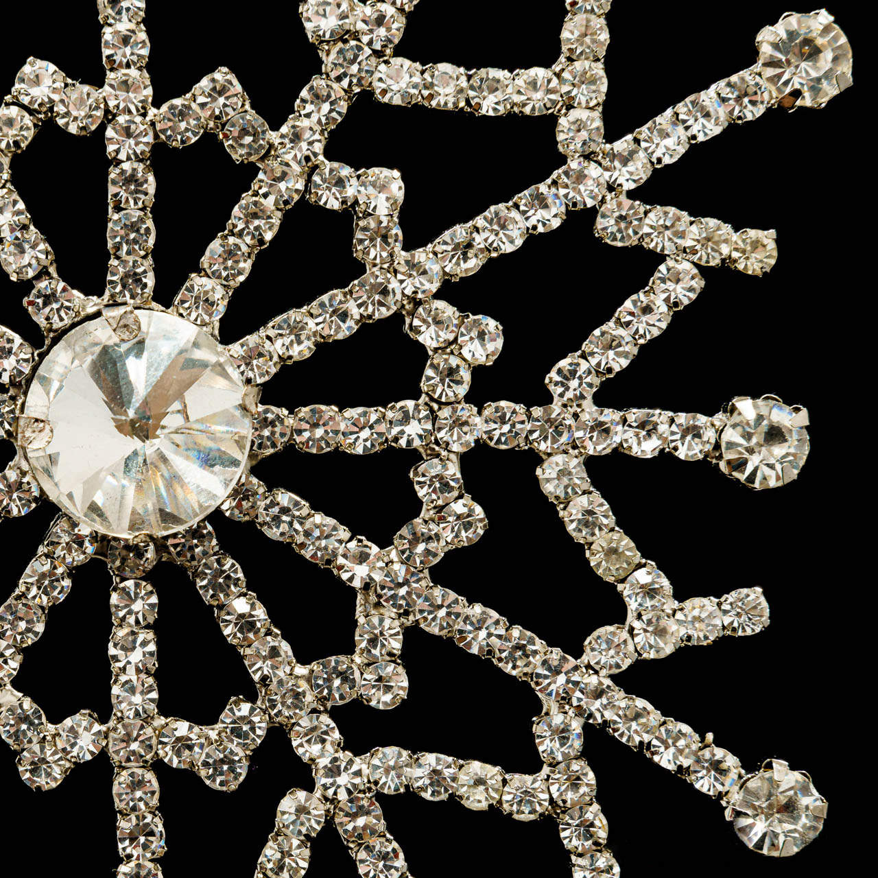 Gleam is a Christmas ornament of metal and rhinestones inspired by 1950's modernism