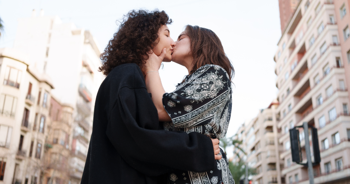 Lesbian bed death myths: a lesbian couple in New York, NY kisses.