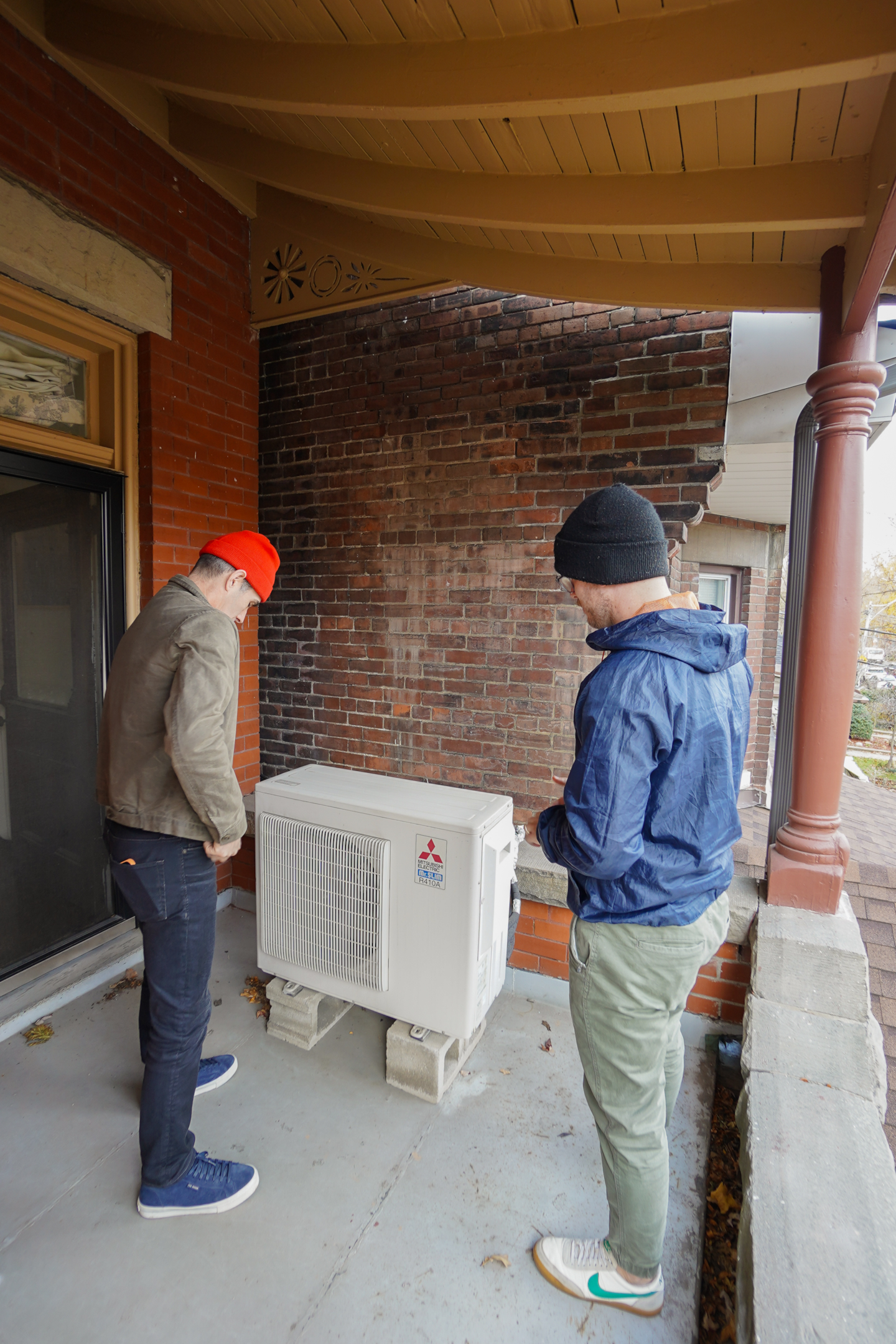 A homeowner and Jouleia expert evaluating a heat pump. 