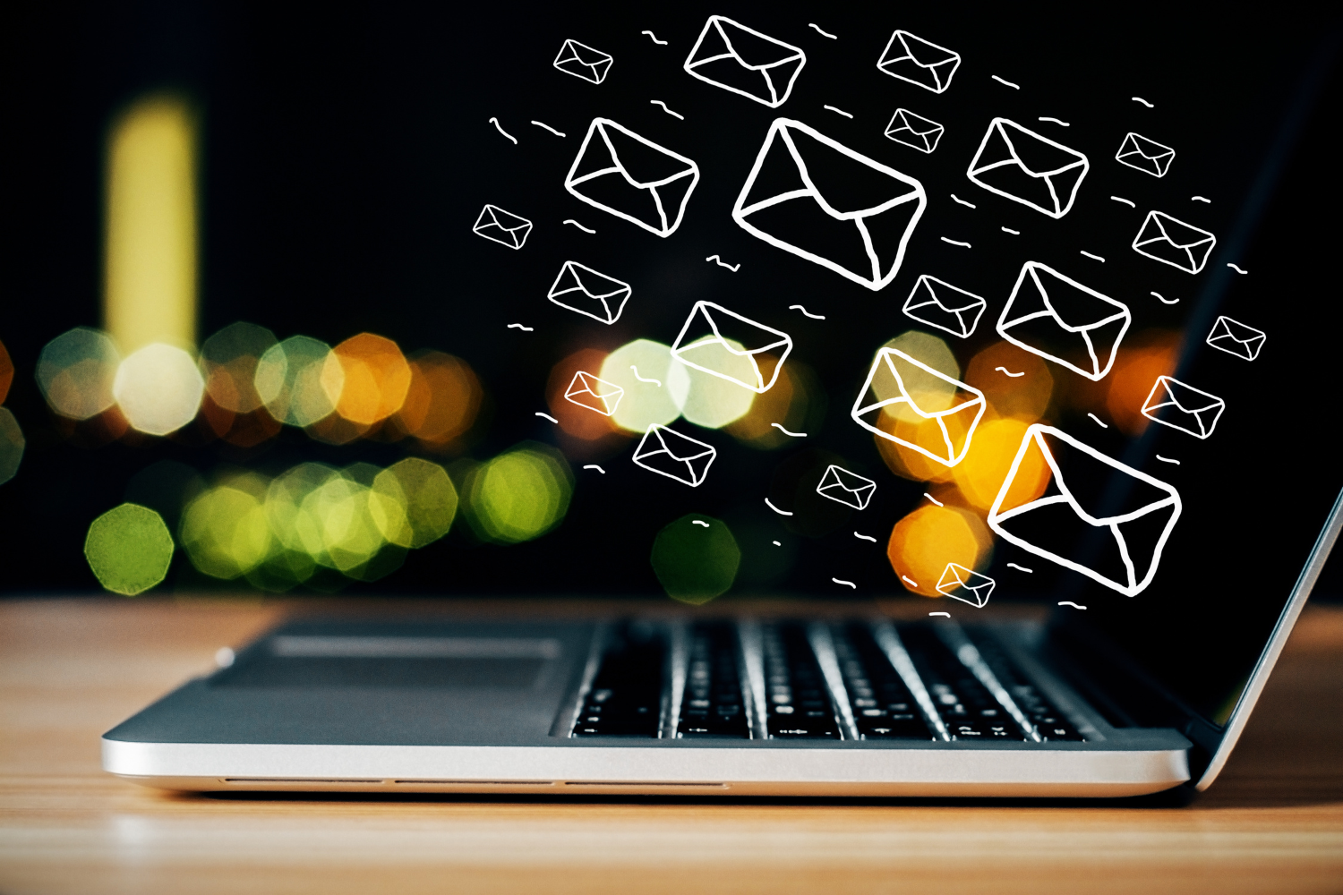 Digital illustration of a laptop with emails being sent.