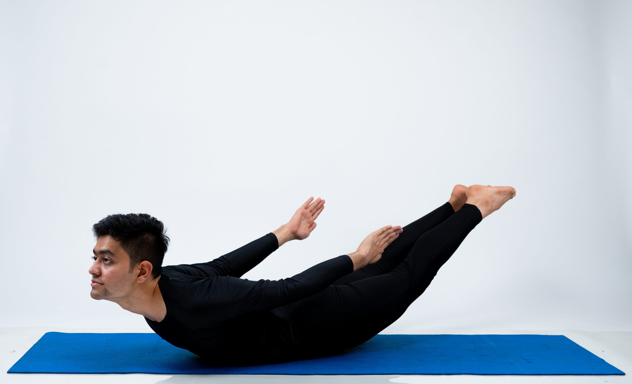 Woman doing salabhasana yoga pose isolated on white background 29176933  Vector Art at Vecteezy