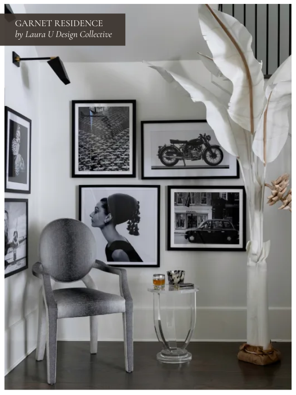 a black and white gallery wall just off the cream and white living room at Garnet Residence