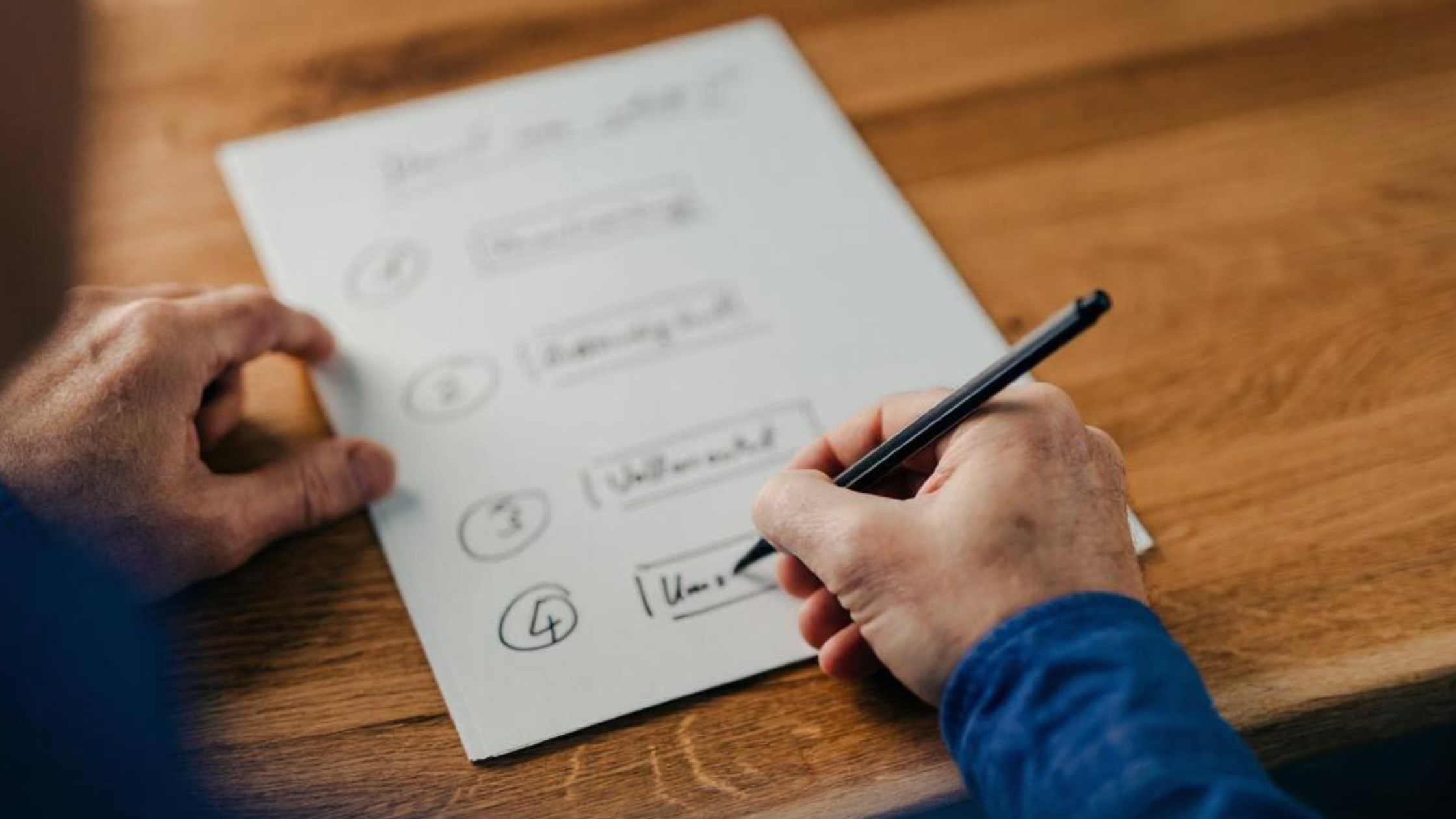 Person checking off a feature list, referencing features like voicemail transcription, interactive voice response, and auto attendants.