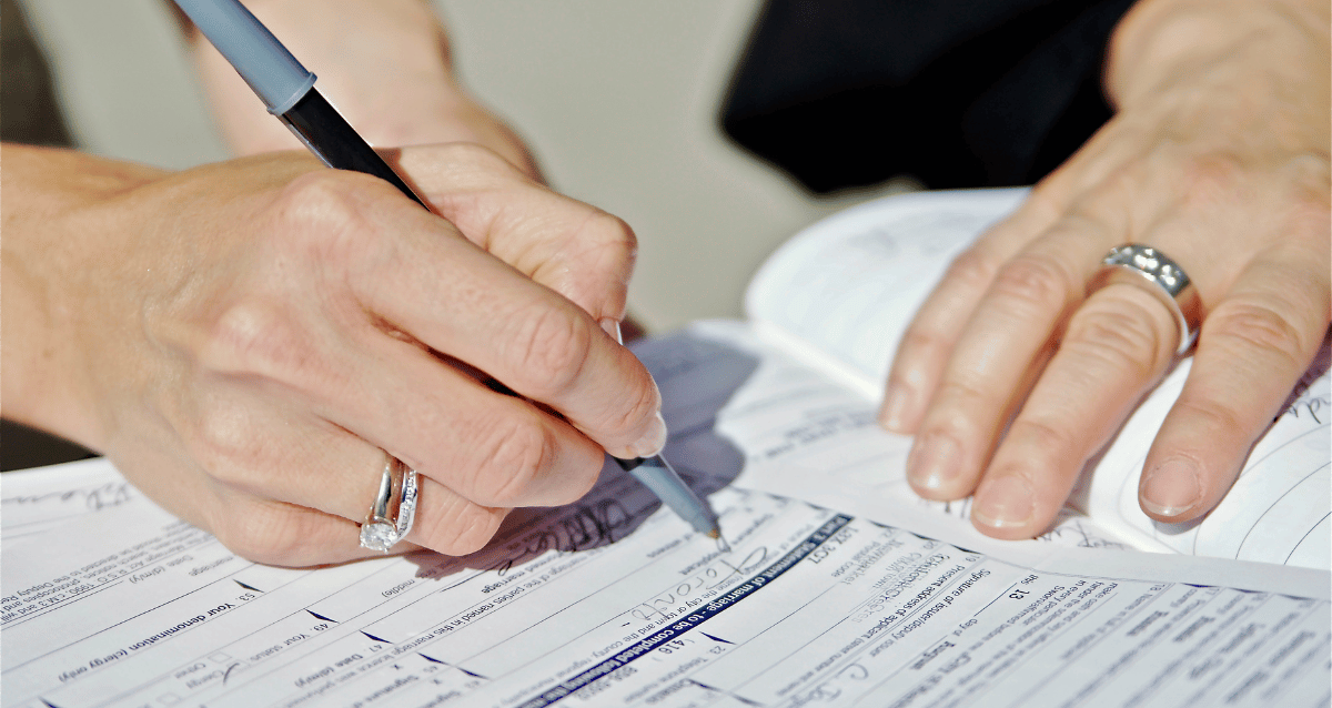 Filling out all the paperwork for registration purposes