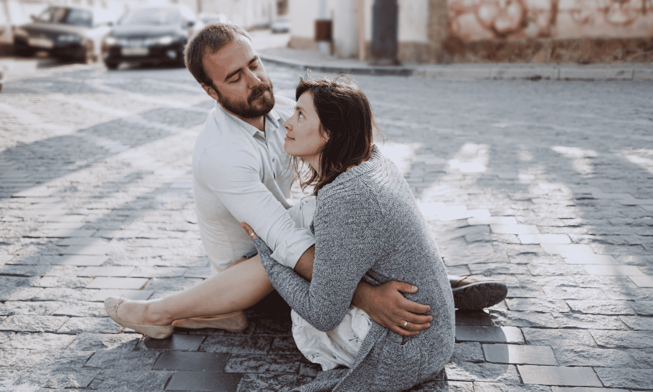 A couple looking at each other thinking about having another kiss.