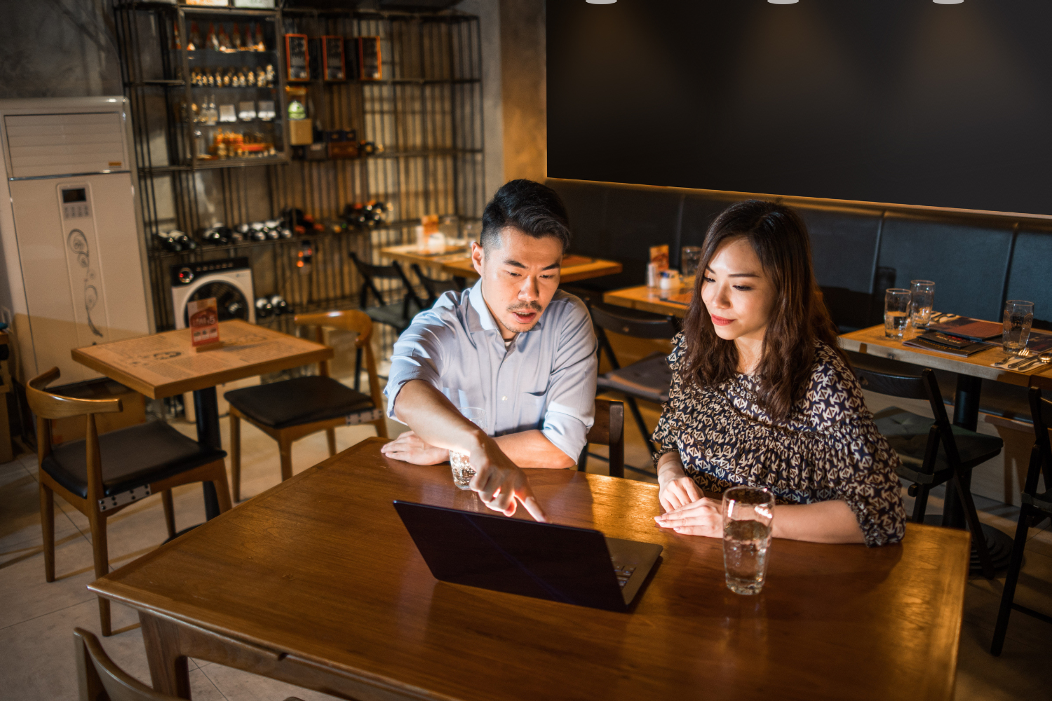 Business owner meeting with a broker to discuss selling a business.