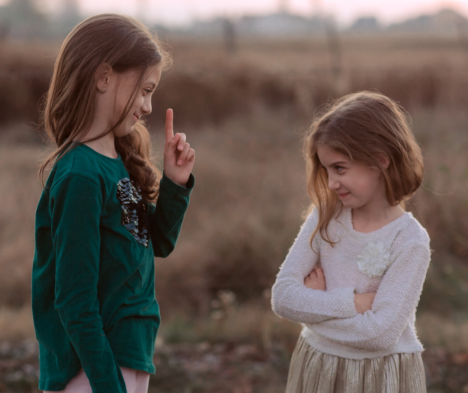 two children argue outside