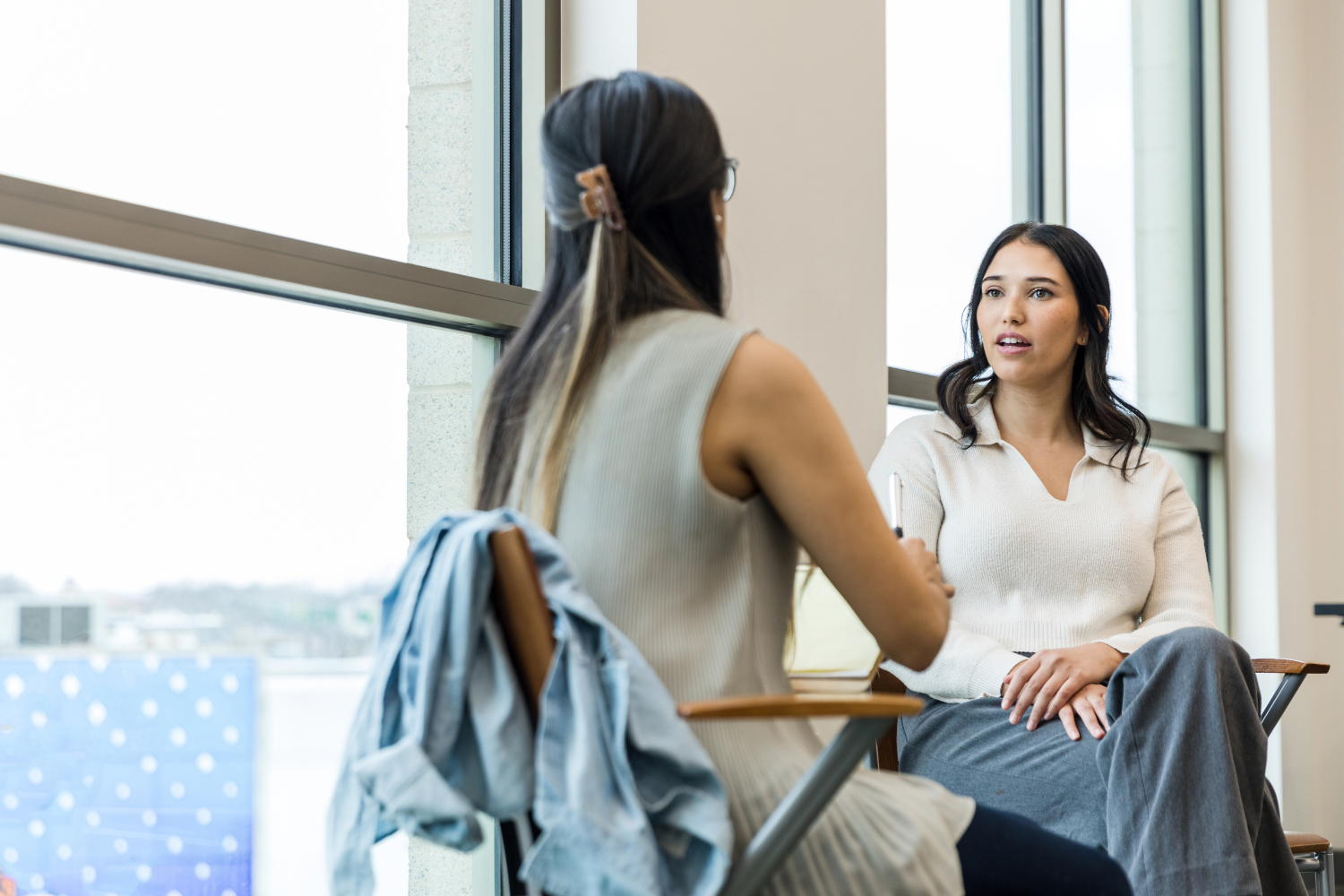A manager and an employee talking.