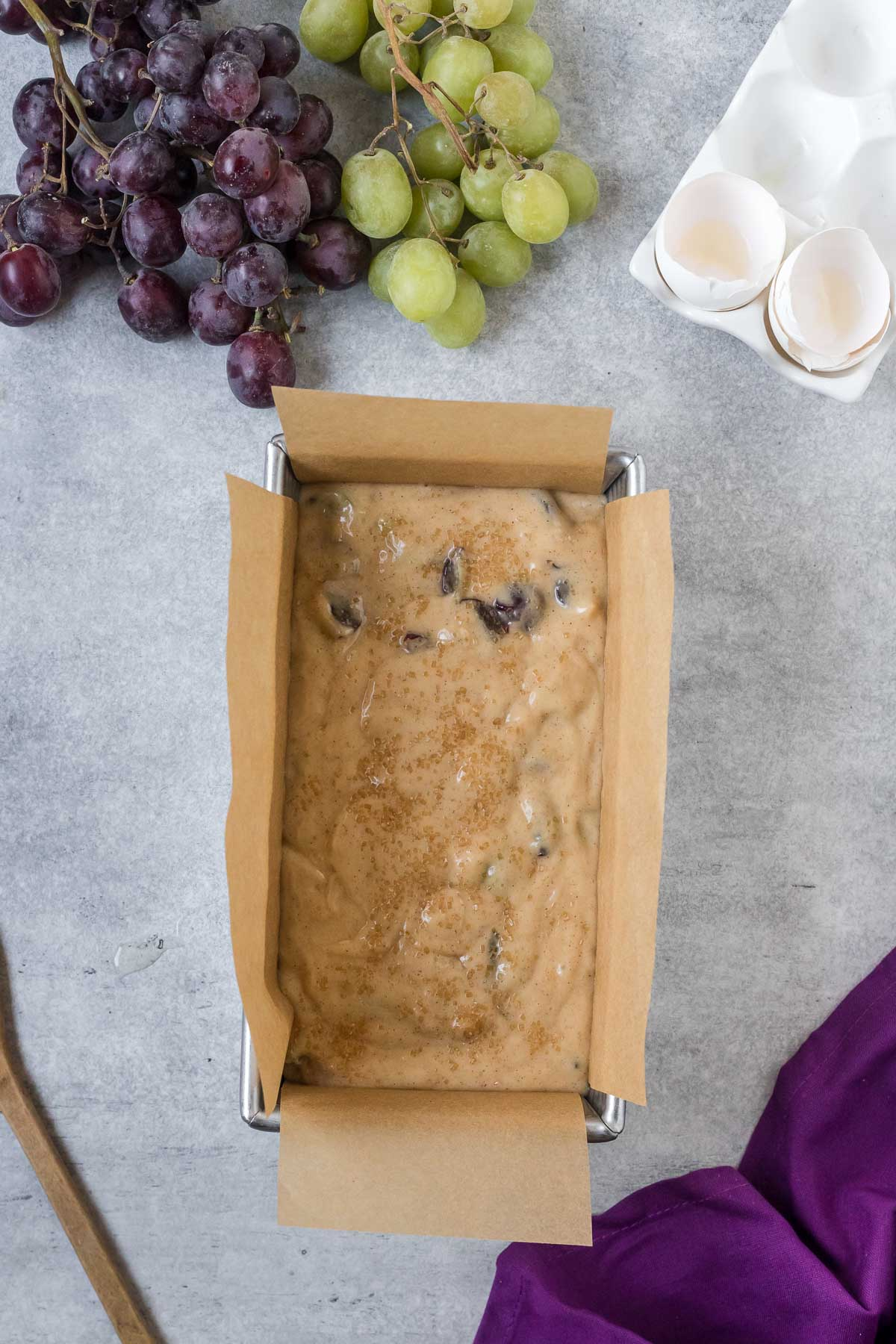 unbaked grape bread in a loaf pan