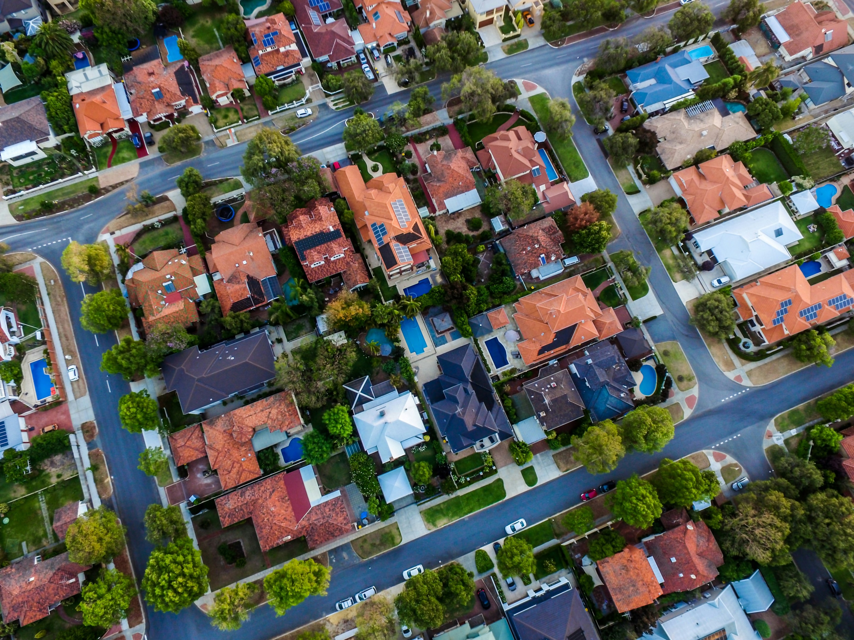 Aerial view of neighborhood with home going through probate.